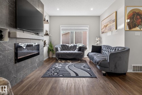 262 Rolston Wynd, Leduc, AB - Indoor Photo Showing Living Room With Fireplace