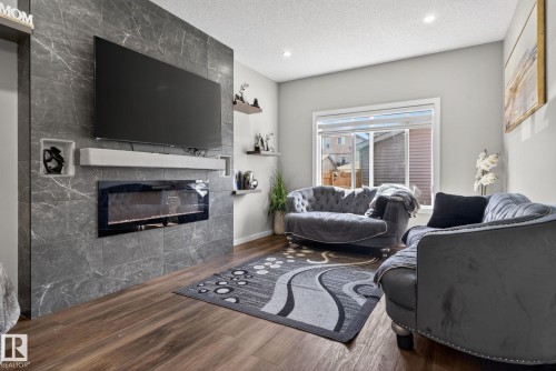 262 Rolston Wynd, Leduc, AB - Indoor Photo Showing Living Room With Fireplace