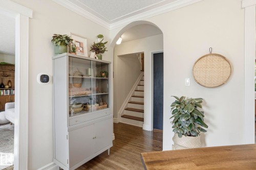 Arched doorway and wood-finish flooring - 4 Langley Dr, Fort Saskatchewan, AB - Indoor Photo Showing Other Room