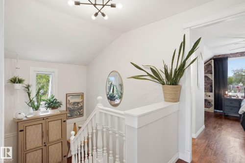 Upper landing featuring white balusters and wood-finish flooring - 4 Langley Dr, Fort Saskatchewan, AB - Indoor Photo Showing Other Room