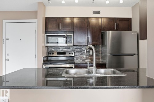 109 11803 22 Avenue, Edmonton, AB - Indoor Photo Showing Kitchen With Stainless Steel Kitchen With Double Sink With Upgraded Kitchen