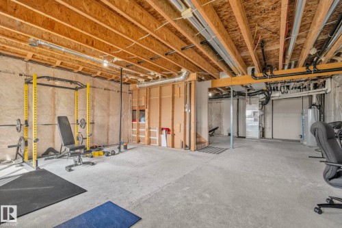 Unfinished basement offering expansive concrete flooring and exposed ceiling joists - 334 Aston Close, Leduc, AB - Indoor Photo Showing Basement