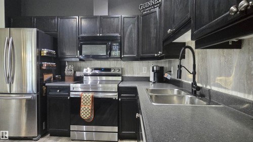 90 3010 33 Avenue, Edmonton, AB - Indoor Photo Showing Kitchen With Stainless Steel Kitchen With Double Sink
