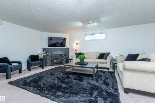 4012 53 Street, Beaumont, AB - Indoor Photo Showing Living Room With Fireplace