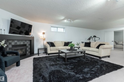 4012 53 Street, Beaumont, AB - Indoor Photo Showing Living Room With Fireplace