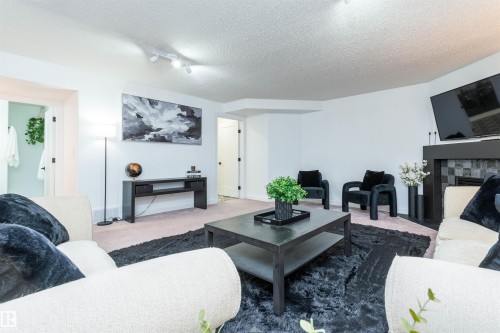 4012 53 Street, Beaumont, AB - Indoor Photo Showing Living Room With Fireplace