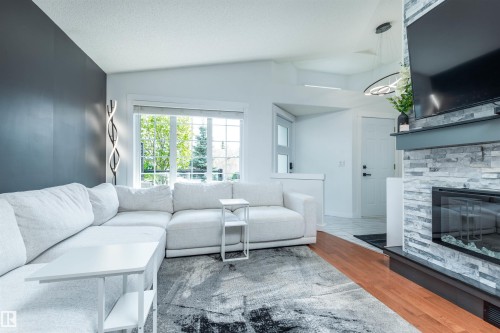 4012 53 Street, Beaumont, AB - Indoor Photo Showing Living Room With Fireplace