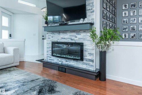 4012 53 Street, Beaumont, AB - Indoor Photo Showing Living Room With Fireplace
