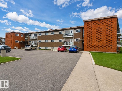 Multi-story residential building featuring brick and panel facades - 17 6215 98 Avenue, Edmonton, AB - Outdoor