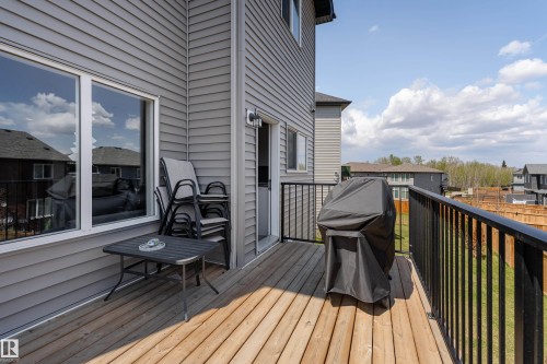 Expansive wood deck with black metal railing - 5323 Lark Landing Landing, Edmonton, AB - Outdoor With Deck Patio Veranda With Exterior