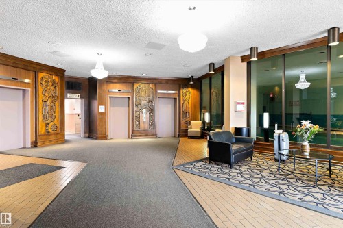 Beautifully carved wood walls. - 304 13910 Stony Plain Road, Edmonton, AB - Indoor Photo Showing Other Room
