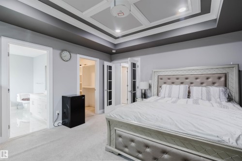 Bedroom featuring a coffered ceiling with recessed lighting, light gray wall paint, and plush carpeting - 17030 62 Street, Edmonton, AB - Indoor Photo Showing Bedroom