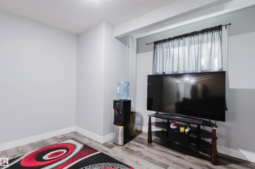 Light grey walls with white trim and wood-finish flooring - 17030 62 Street, Edmonton, AB - Indoor