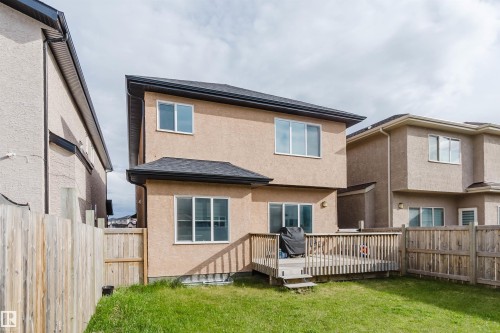 Rear exterior with stucco siding and a ground-level wood deck - 17030 62 Street, Edmonton, AB - Outdoor With Deck Patio Veranda With Exterior