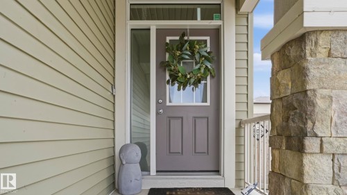Entryway featuring a paneled door with glass inserts and a sidelight - 2620 Adam Crest, Edmonton, AB - Outdoor With Exterior