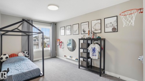 Bright room with a large window and grey carpeting - 2620 Adam Crest, Edmonton, AB - Indoor Photo Showing Other Room