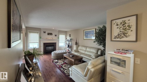 2044 33B Street Nw, Edmonton, AB - Indoor Photo Showing Living Room With Fireplace