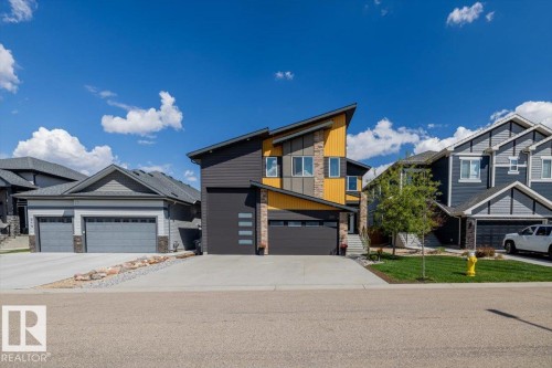 Modern architectural design featuring a prominent angled roofline and multi-toned siding - 219 Cranberry Bend, Fort Saskatchewan, AB - Outdoor With Facade