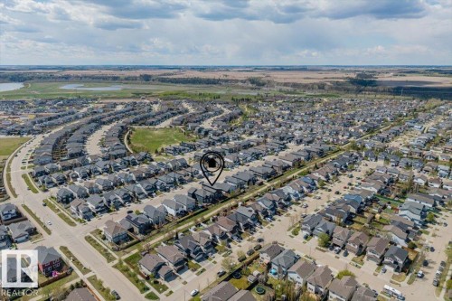 Aerial perspective showcasing a developed residential community with numerous single-family homes - 219 Cranberry Bend, Fort Saskatchewan, AB - Outdoor With View