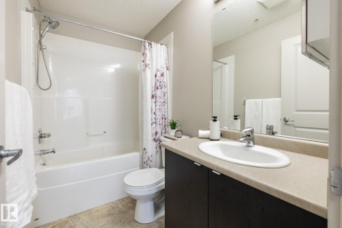 Full bathroom featuring a white tub and shower combination with chrome fixtures - 131 344 Windermere Road, Edmonton, AB - Indoor Photo Showing Bathroom