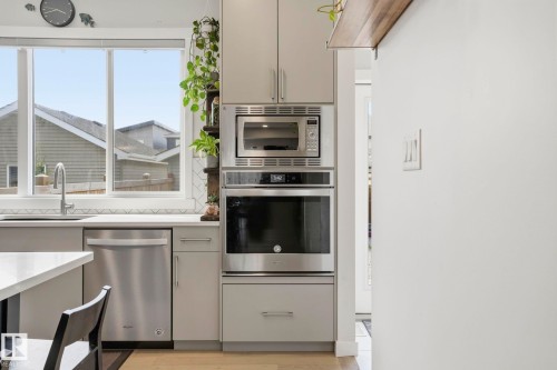 Kitchen featuring a stainless steel dishwasher, built-in wall oven, and microwave - 2116 159 Street, Edmonton, AB - Indoor Photo Showing Kitchen