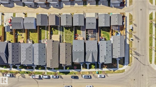 Row of residential properties featuring shingled roofs and private rear yards - 2116 159 Street, Edmonton, AB - Other