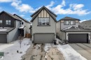 The property features a two-story design with light gray siding and dark gray trim accents - 21853 98A Avenue, Edmonton, AB  - Outdoor With Facade 