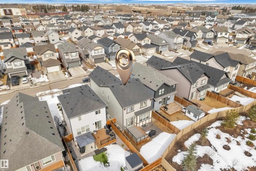 Aerial view of the property and surrounding neighborhood, featuring a large backyard with a wood deck and a shed - 21853 98A Avenue, Edmonton, AB - Outdoor With View