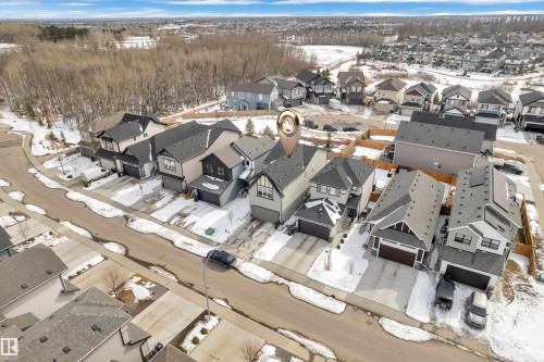 Aerial view of a residential neighborhood with detached properties featuring paved driveways and attached garages - 21853 98A Avenue, Edmonton, AB - Outdoor With View