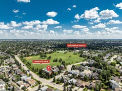 Expansive aerial view showcasing a residential neighborhood with Greenview Park and Greenview School - 