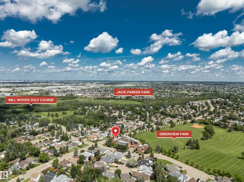 Aerial view showcasing a residential neighborhood with extensive green spaces and urban amenities - 5953 40 Avenue, Edmonton, AB 