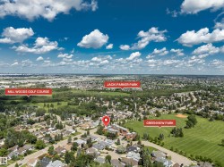 Aerial view showcasing a residential neighborhood with extensive green spaces and urban amenities - 