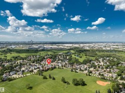 Aerial perspective showcasing a residential area with extensive green spaces - 