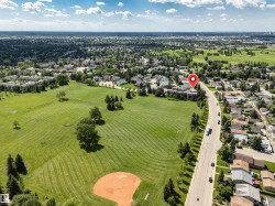 Aerial depiction of a residential area bordering a park - 