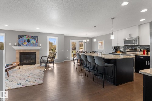 110 Aspenglen Drive, Spruce Grove, AB - Indoor Photo Showing Kitchen With Fireplace With Upgraded Kitchen