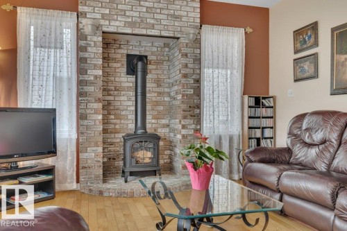 1957 Tomlinson Square Square, Edmonton, AB - Indoor Photo Showing Living Room With Fireplace