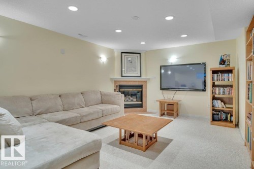 1957 Tomlinson Square Square, Edmonton, AB - Indoor Photo Showing Living Room With Fireplace