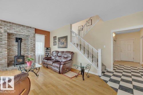 1957 Tomlinson Square Square, Edmonton, AB - Indoor Photo Showing Living Room With Fireplace
