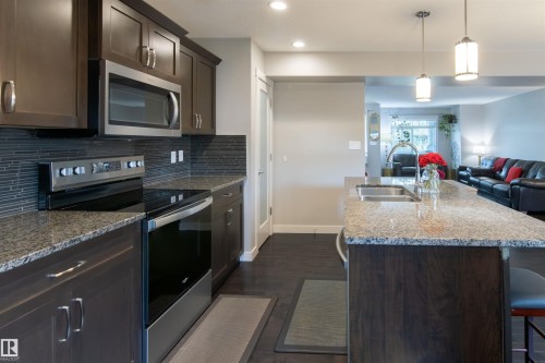 136 Cy Becker Boulevard, Edmonton, AB - Indoor Photo Showing Kitchen With Stainless Steel Kitchen With Double Sink With Upgraded Kitchen