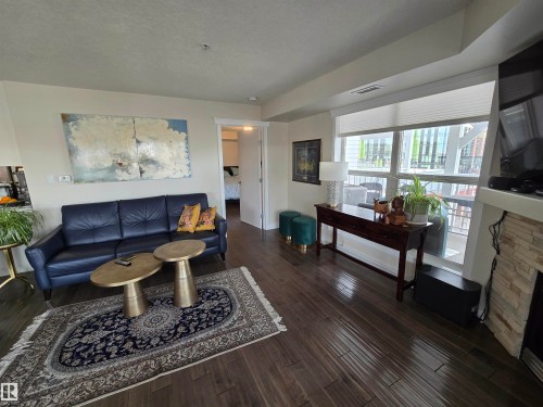 404 10311 111 Street, Edmonton, AB - Indoor Photo Showing Living Room With Fireplace