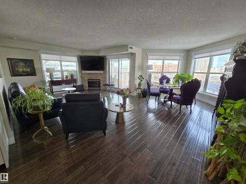404 10311 111 Street, Edmonton, AB - Indoor Photo Showing Living Room With Fireplace