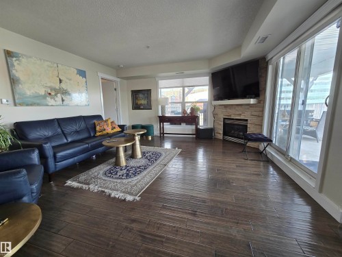 404 10311 111 Street, Edmonton, AB - Indoor Photo Showing Living Room With Fireplace