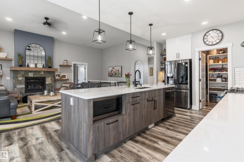2011 Spring Drive, Rural Parkland County, AB - Indoor Photo Showing Kitchen With Fireplace With Upgraded Kitchen