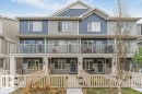 Three-story townhome featuring a multi-tone facade with both horizontal and vertical siding - 53 1110 Daniels Link Link, Edmonton, AB  - Outdoor With Balcony With Facade 