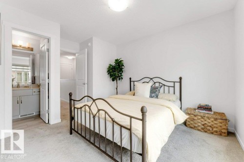 Bedroom featuring soft carpet flooring and a neutral color palette - 53 1110 Daniels Link Link, Edmonton, AB - Indoor Photo Showing Bedroom