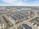 Expansive aerial view showcasing a developed residential area with a mix of detached homes and multi-story townhomes - 53 1110 Daniels Link Link, Edmonton, AB  - Outdoor With View 