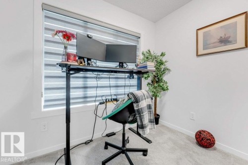 Bright room featuring a window with banded shades, light gray carpet flooring, white walls, and white baseboards - 53 1110 Daniels Link Link, Edmonton, AB - Indoor