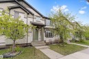 Multi-level residential exterior featuring light-colored siding with dark trim accents - 336 Watt Boulevard, Edmonton, AB  - Outdoor 