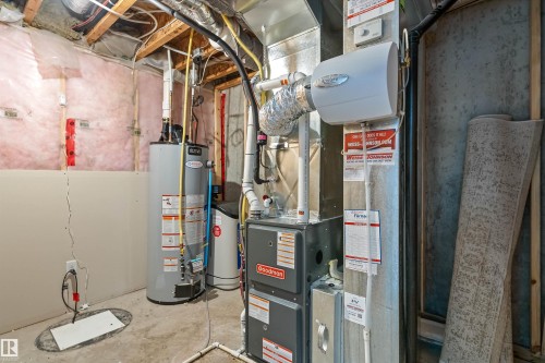 Utility area featuring a water heater, furnace, and humidifier unit - 336 Watt Boulevard, Edmonton, AB - Indoor Photo Showing Basement