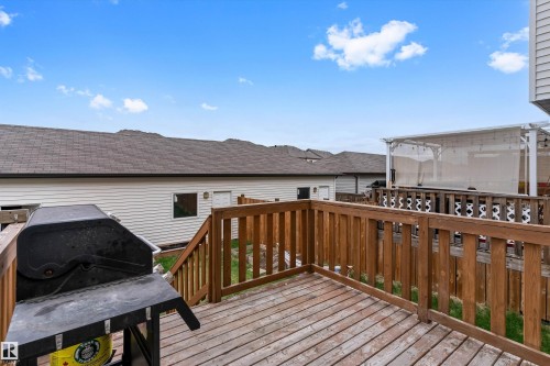 Expansive wood deck with a full-height wood railing and staircase - 336 Watt Boulevard, Edmonton, AB - Outdoor With Deck Patio Veranda With Exterior